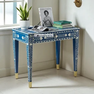 Handcrafted deep blue bone inlay console table featuring intricate ivory floral motifs and slim wooden legs – perfect for hallway or entryway decor.